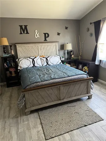 a bedroom with a bed and window