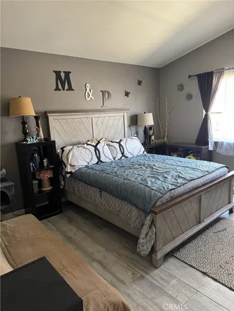 a bedroom with a bed and window