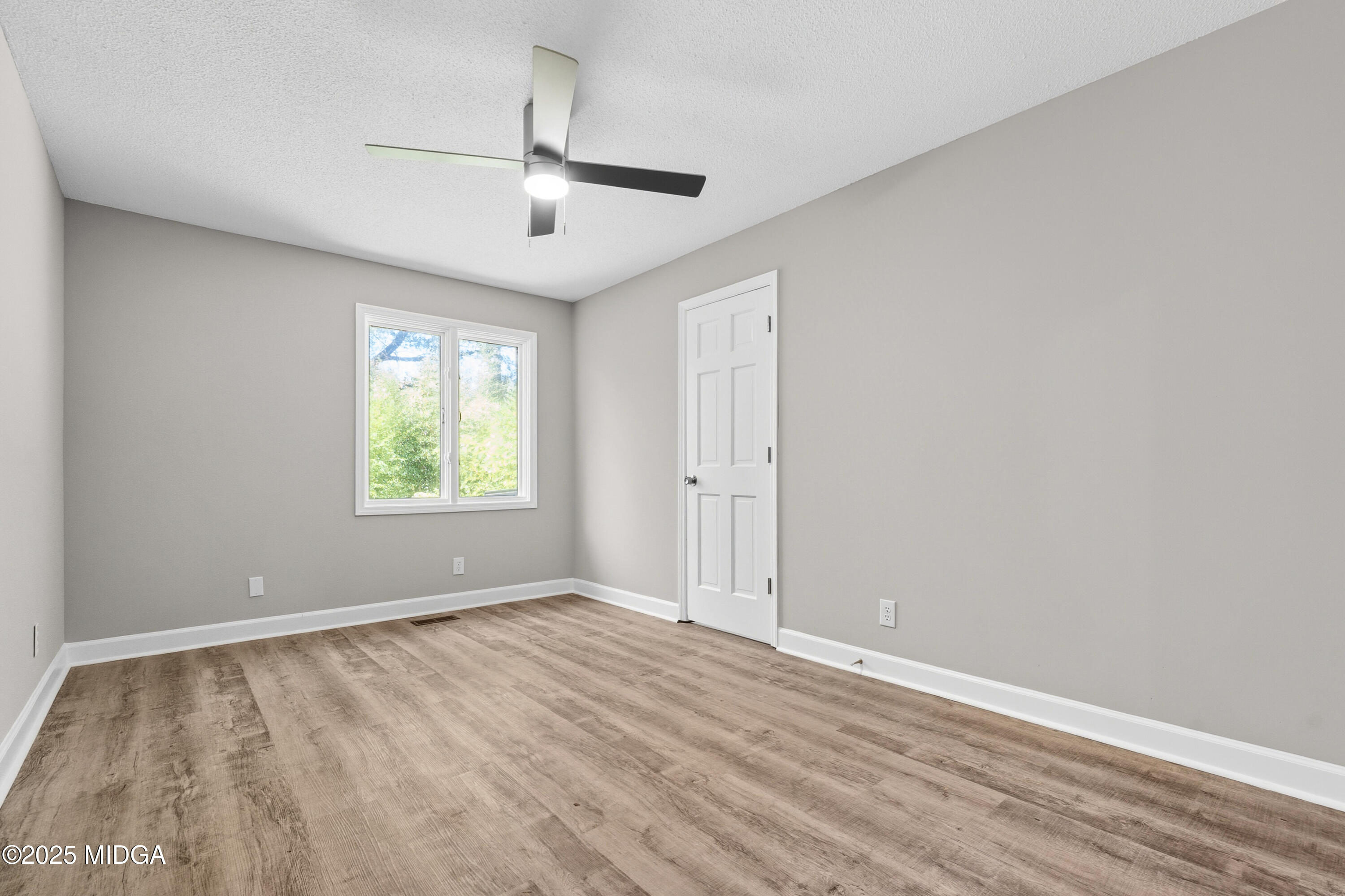 200 Stone Edge Road Macon, GA 31210 - Photo 42 of 58 wooden floor in an empty room with a window