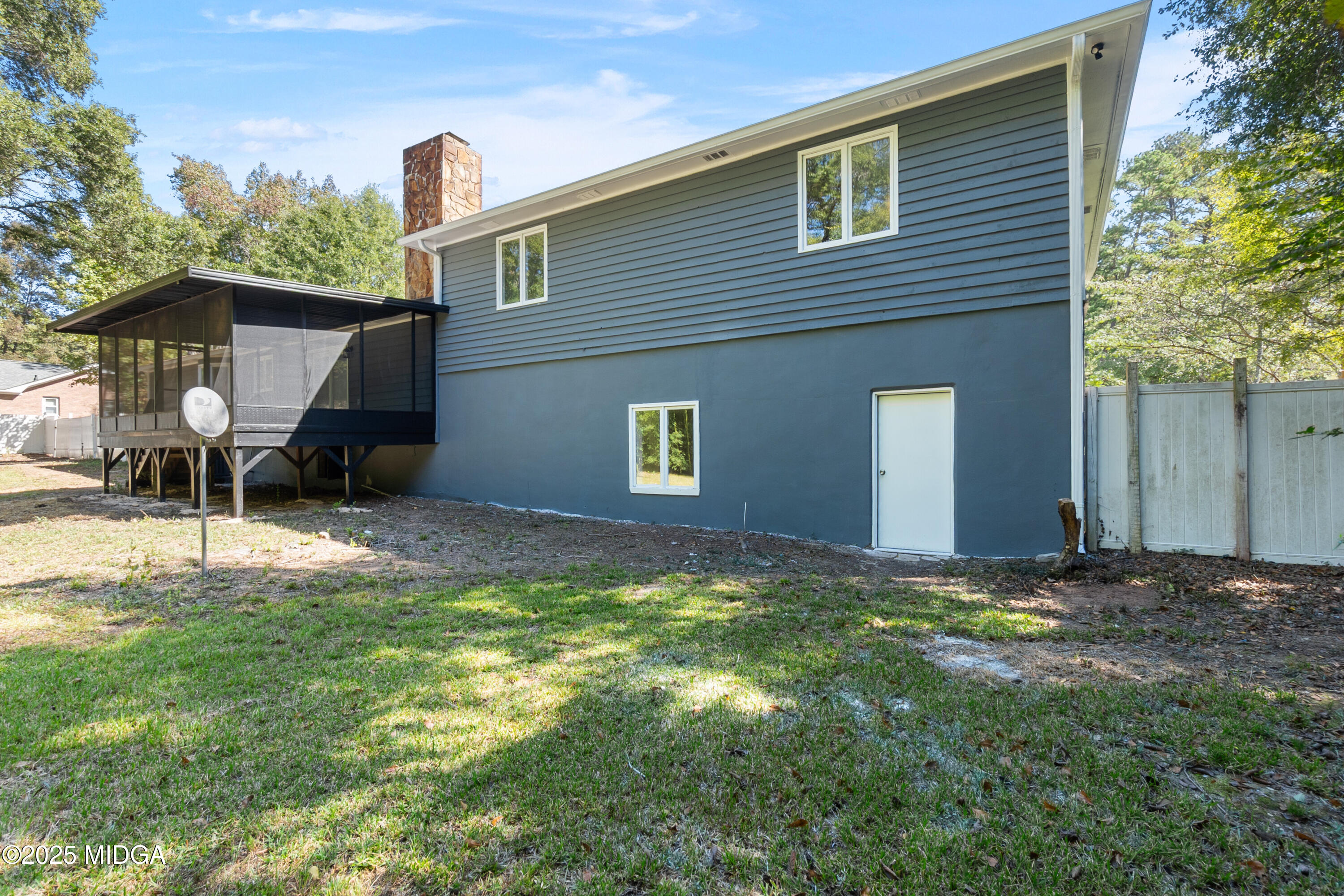200 Stone Edge Road Macon, GA 31210 - Photo 54 of 58 a backyard of a house with table and chairs