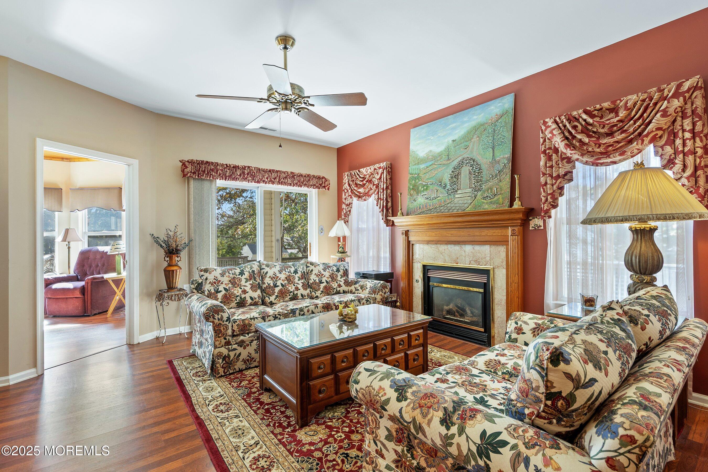 10 Hampton Road Manahawkin, NJ 08050 - Photo 20 of 38 a living room with furniture a flat screen tv and a fireplace