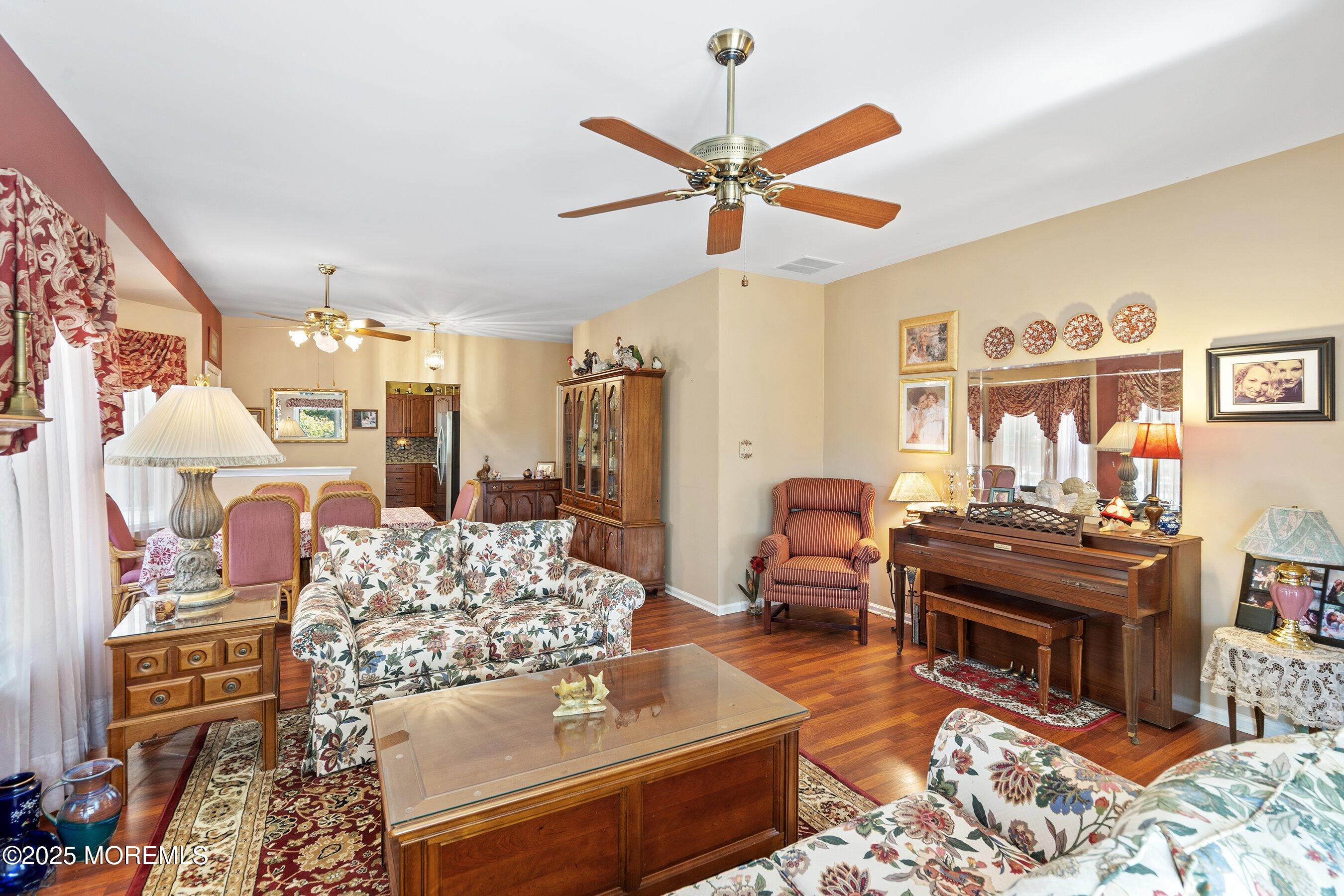 10 Hampton Road Manahawkin, NJ 08050 - Photo 21 of 38 a living room with furniture and a chandelier