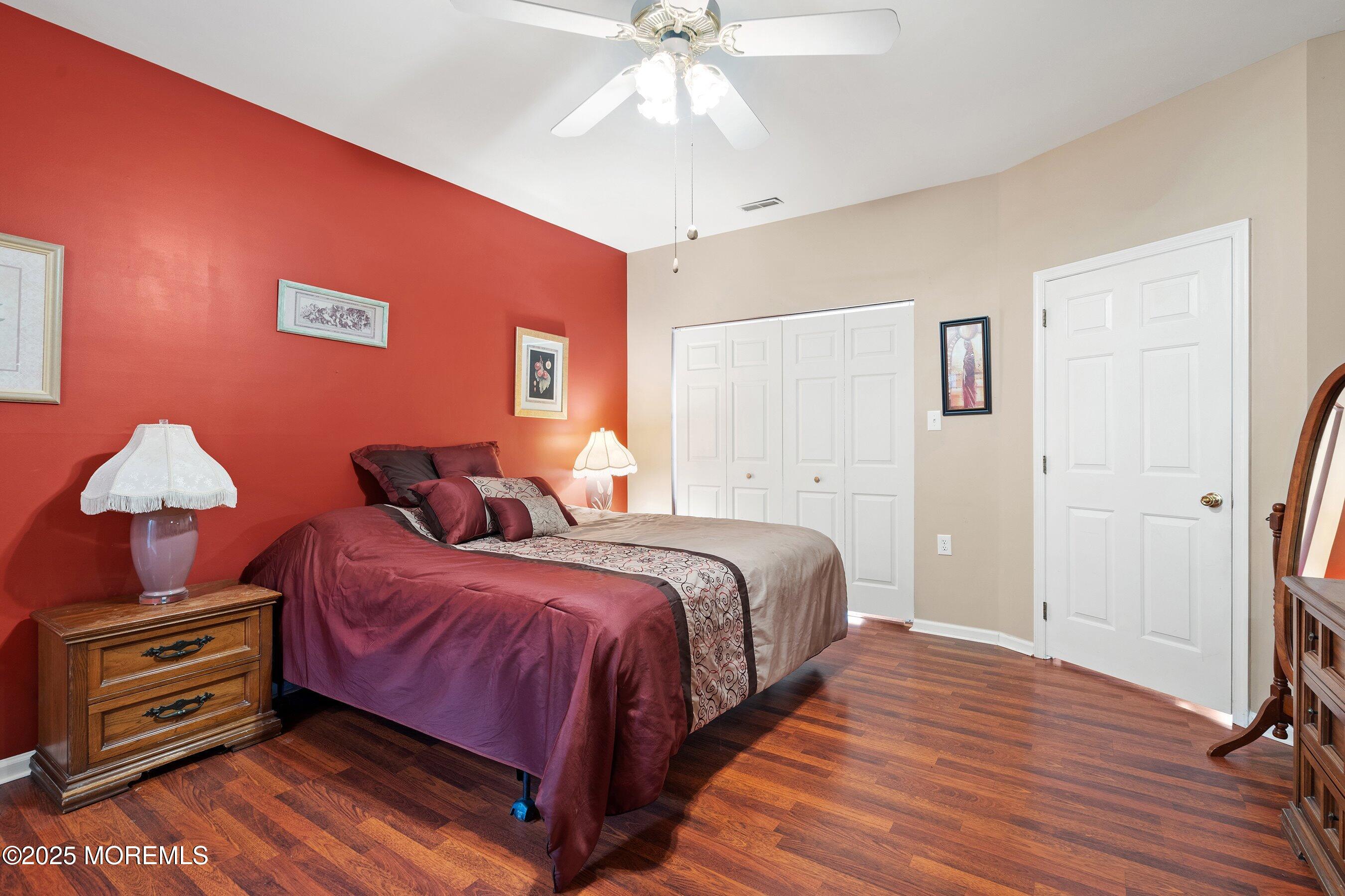 10 Hampton Road Manahawkin, NJ 08050 - Photo 22 of 38 a bedroom with bed and a chandelier