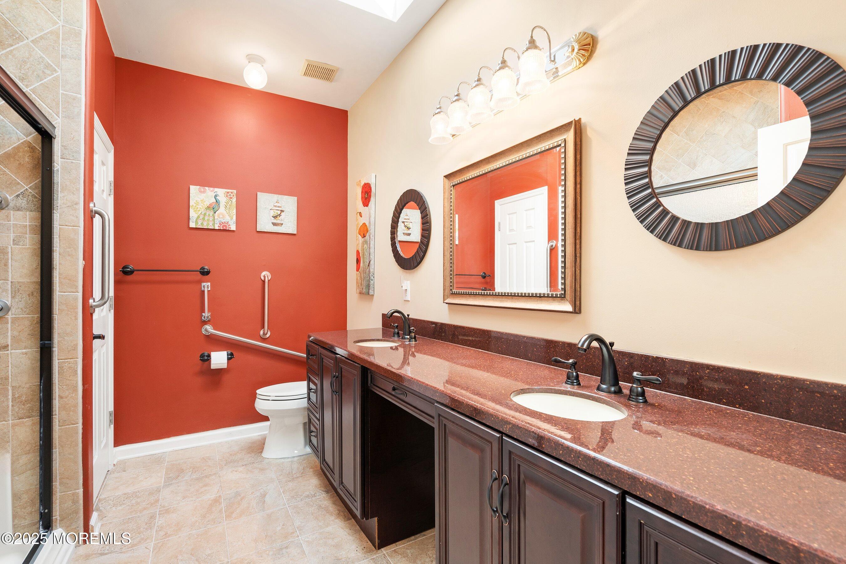 10 Hampton Road Manahawkin, NJ 08050 - Photo 25 of 38 a bathroom with a sink and a mirror