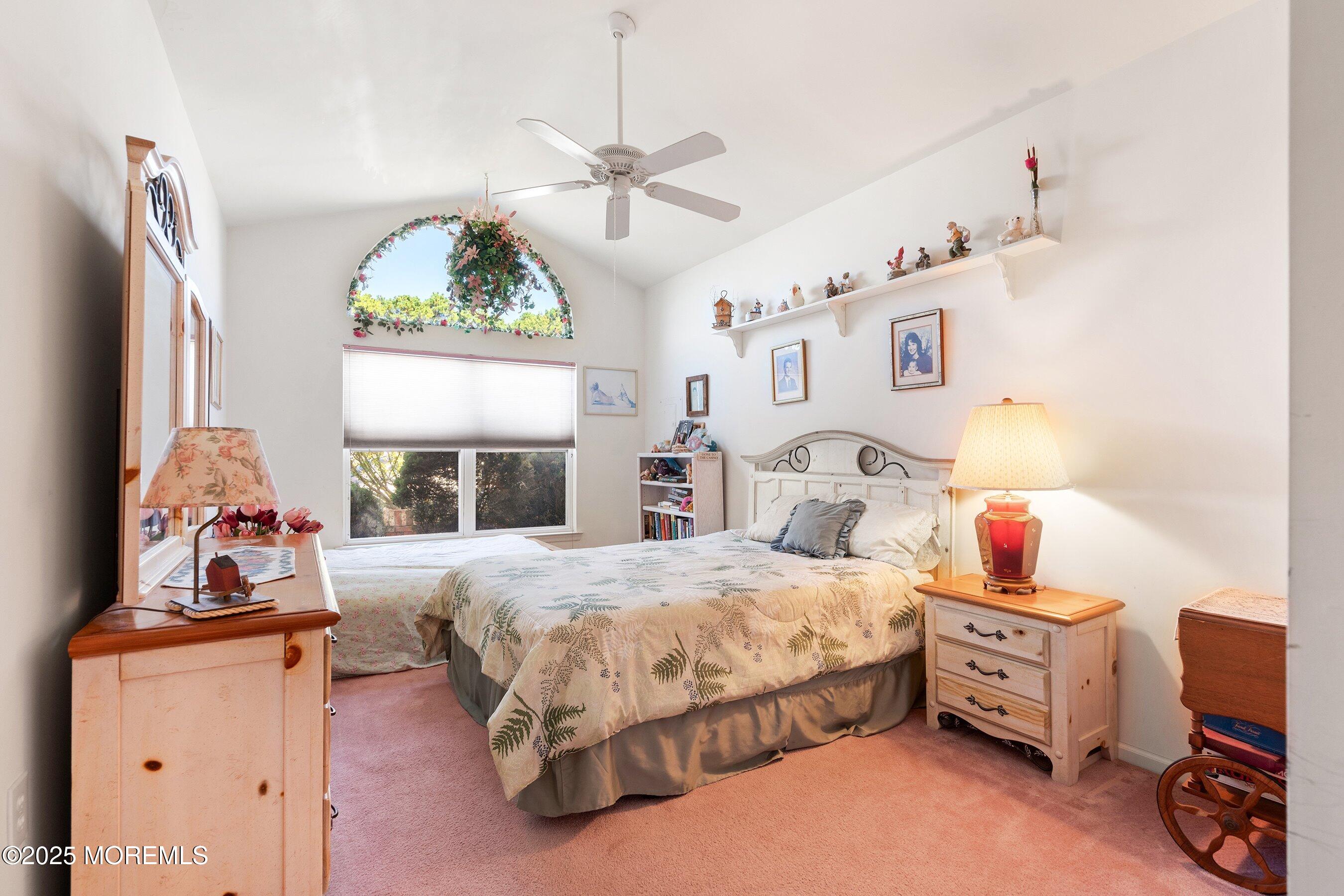10 Hampton Road Manahawkin, NJ 08050 - Photo 28 of 38 a bedroom with a bed and a chandelier