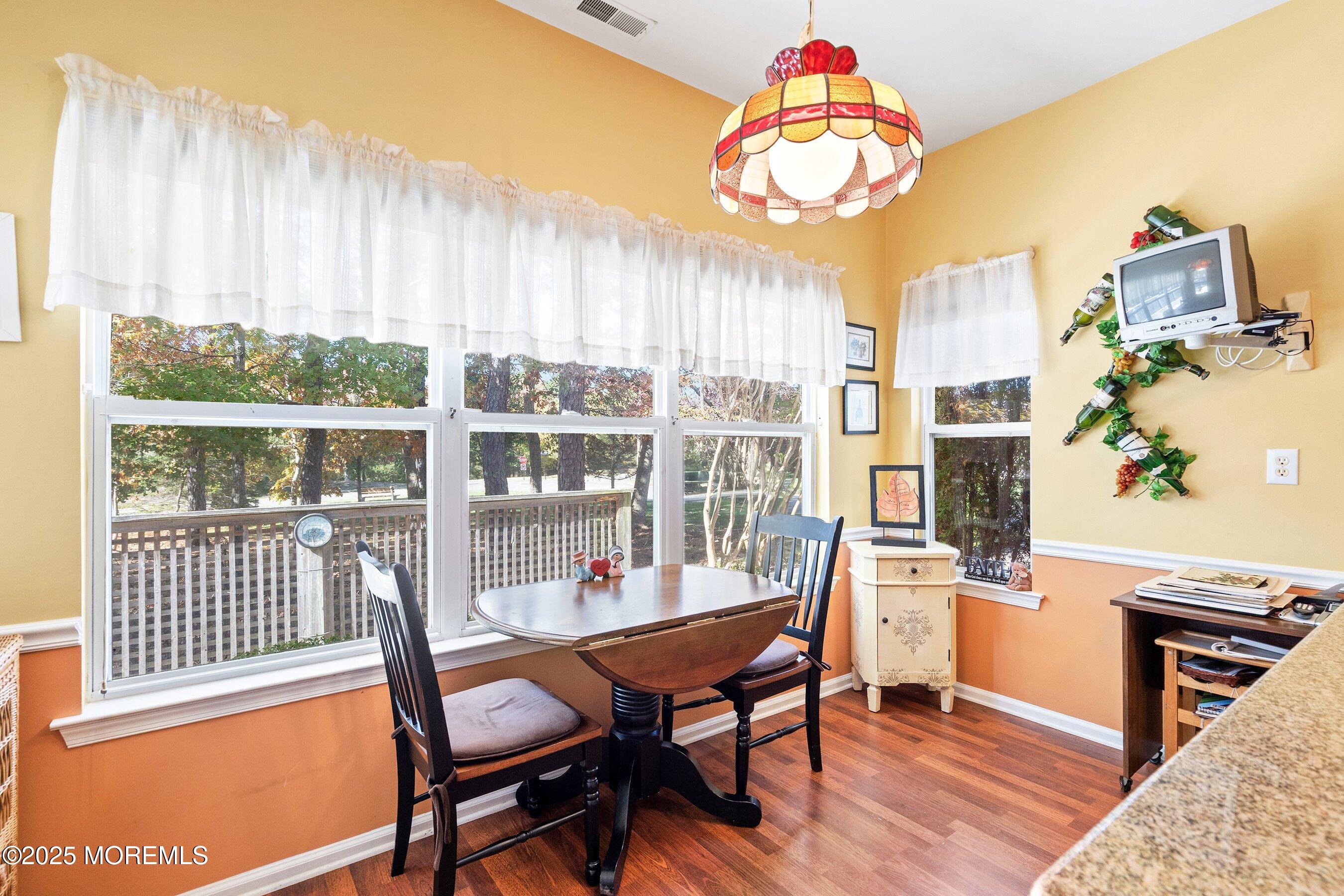 10 Hampton Road Manahawkin, NJ 08050 - Photo 10 of 38 a outdoor dining room with furniture a rug and a chandelier