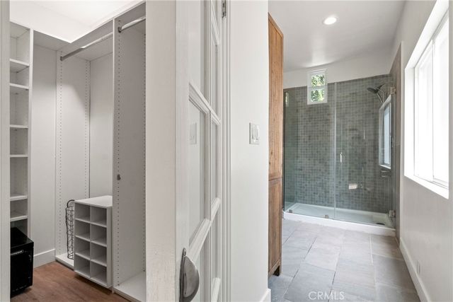 a bathroom with a shower and a sink