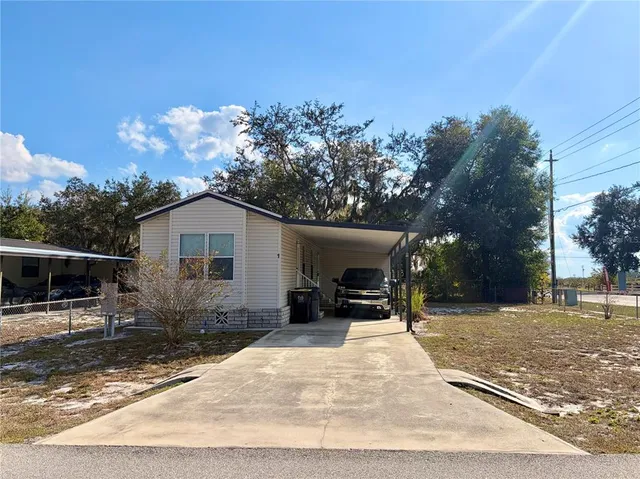a view of a backyard with sitting area and furniture