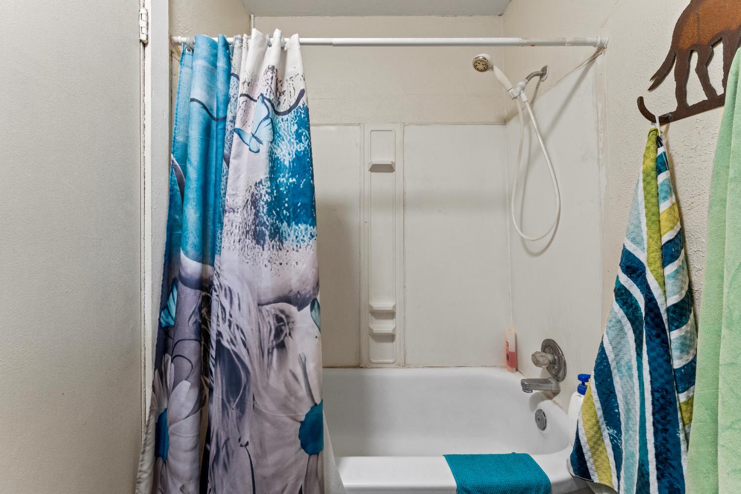 5912 Grove Avenue Marysville, CA 95901 - Photo 17 of 23 a bathroom with a bathtub and shower
