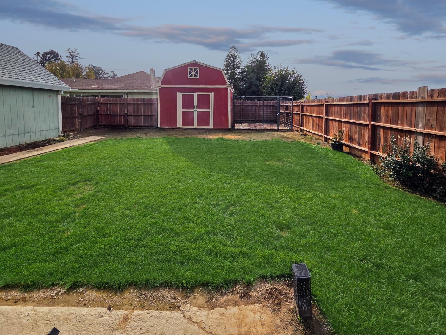 5912 Grove Avenue Marysville, CA 95901 - Photo 23 of 23 a view of a yard with a small yard and wooden fence