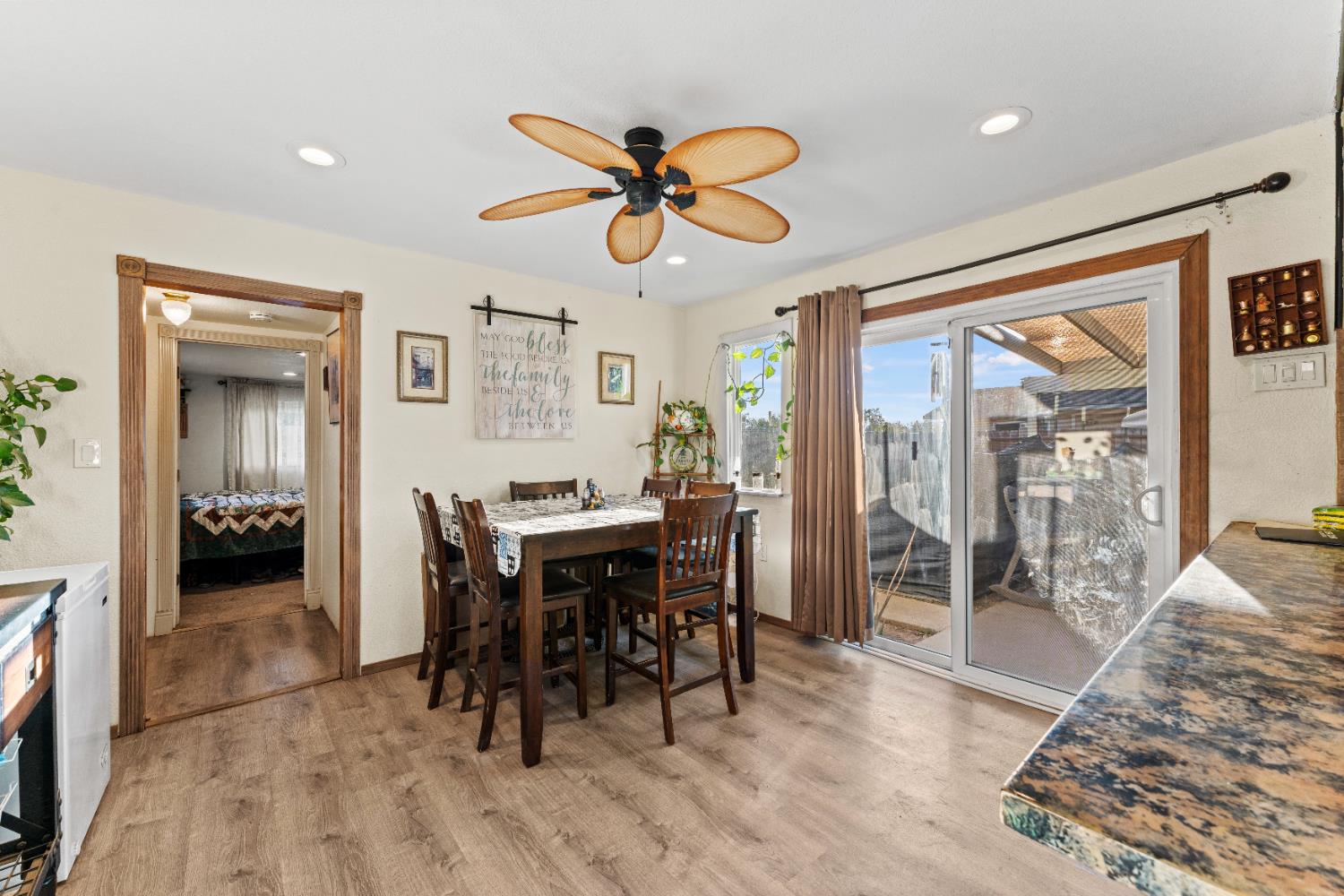 5912 Grove Avenue Marysville, CA 95901 - Photo 5 of 23 a view of a dining room with furniture window and wooden floor