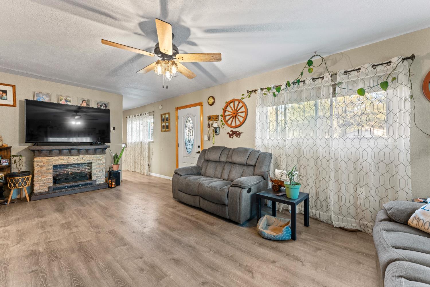 5912 Grove Avenue Marysville, CA 95901 - Photo 10 of 23 a living room with furniture and a flat screen tv