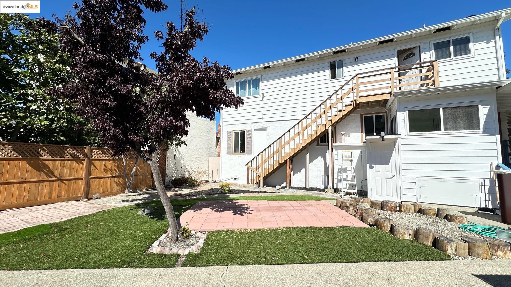 840 Key Rte Boulevard Albany, CA 94706 - Photo 17 of 29 Rear view of property featuring stairway and a patio area