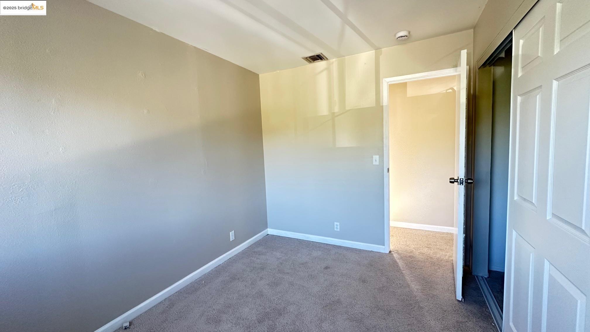 840 Key Rte Boulevard Albany, CA 94706 - Photo 28 of 29 Empty room with carpet and baseboards