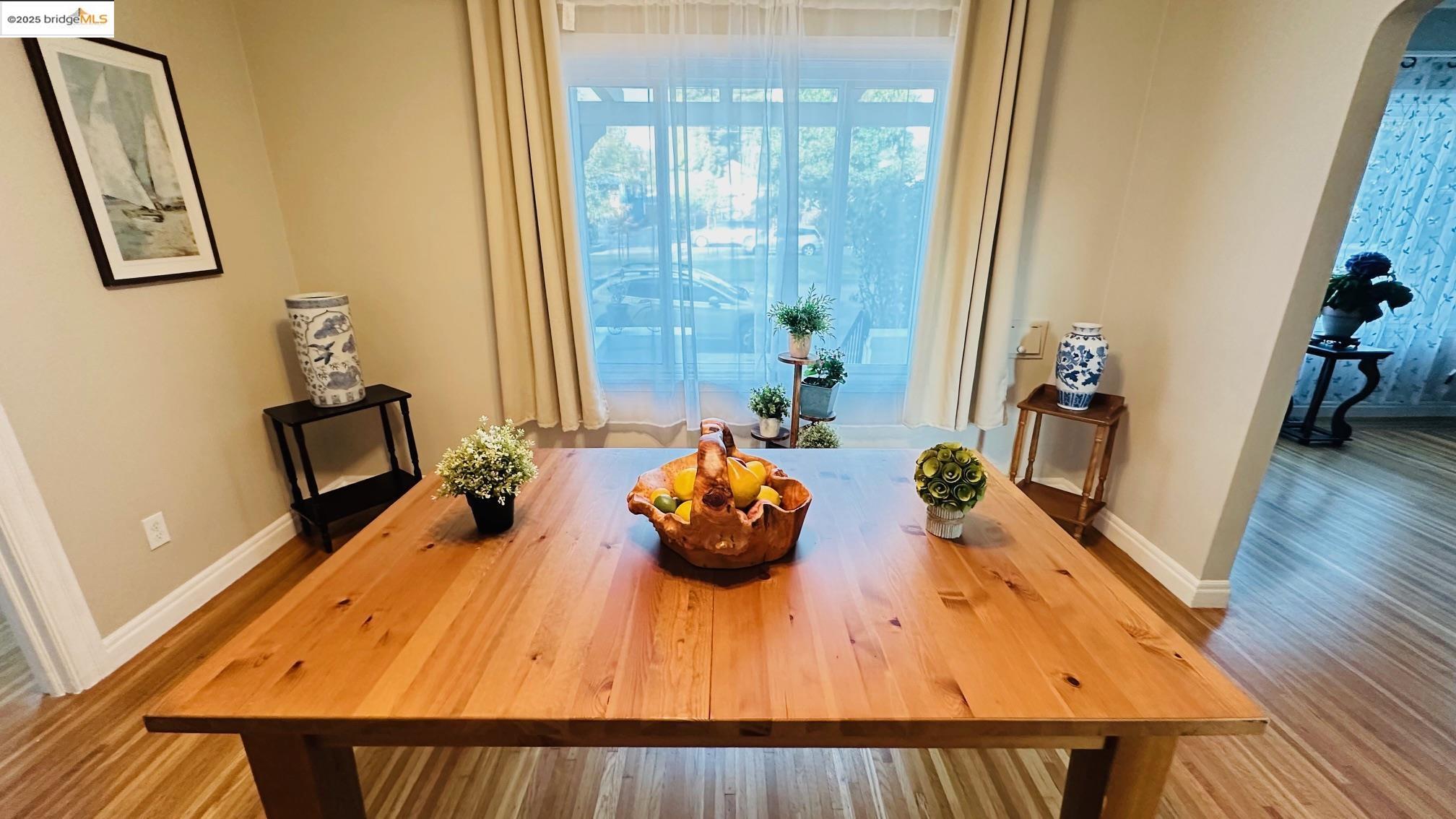 840 Key Rte Boulevard Albany, CA 94706 - Photo 9 of 29 Dining area with arched walkways and wood finished floors