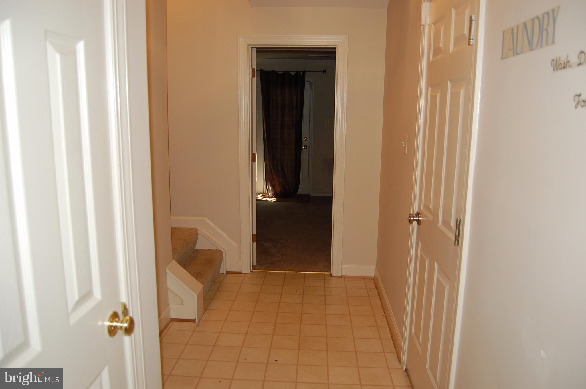 20395 Marguritte Square Sterling, VA 20165 - Photo 24 of 29 Level 1 Hallway to Garage, Laundry, and Rec Room