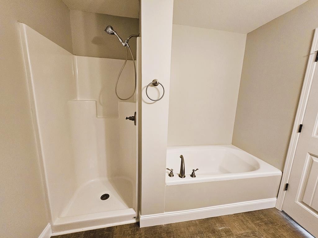 4835 Cameron Road Morristown, TN 37814 - Photo 13 of 25 a white bath tub sitting next to a shower