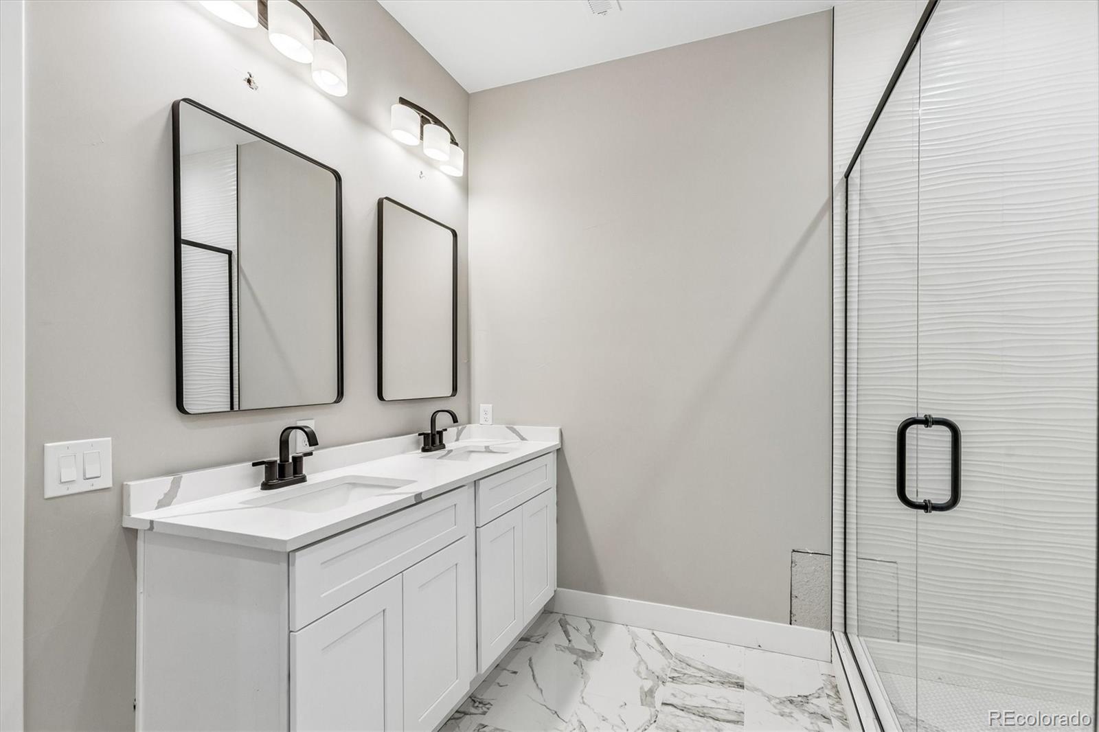 13350 Imboden Road Hudson, CO 80642 - Photo 23 of 50 a bathroom with a sink vanity and mirror
