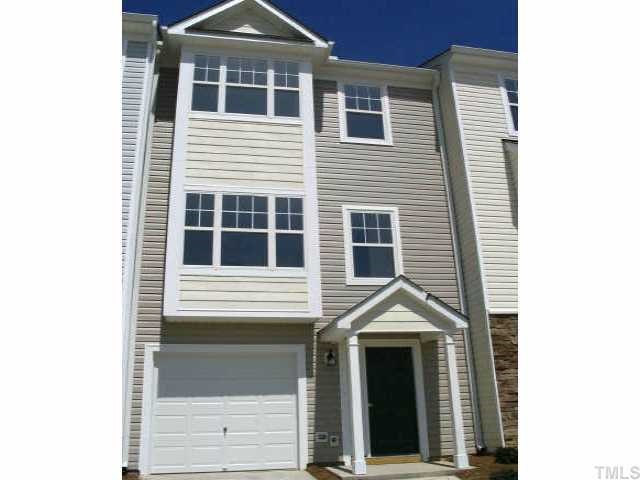 4909 Midstone Lane Raleigh, NC 27610 - Photo 1 of 1 a front view of a house with a yard