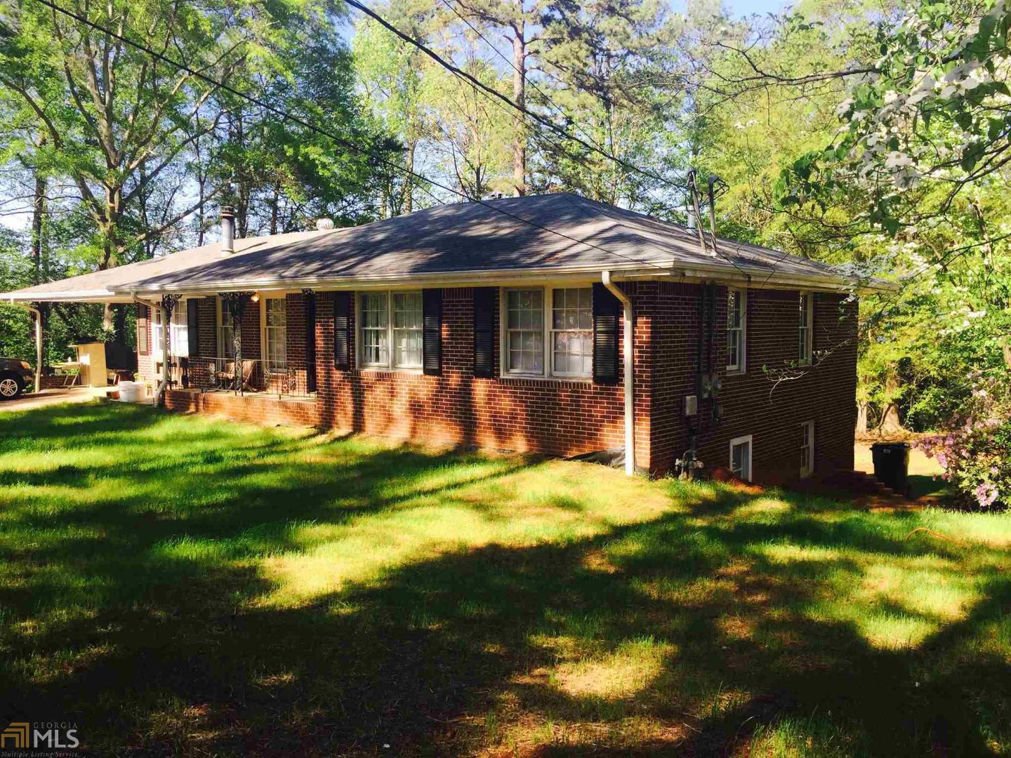100 Pinecrest Lodge Road Athens, GA 30605 - Photo 1 of 1 a front view of a house with a yard table and chairs