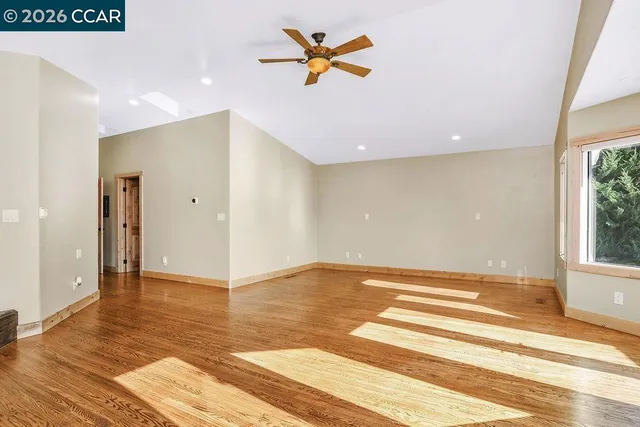 a view of backyard with outdoor seating and trees