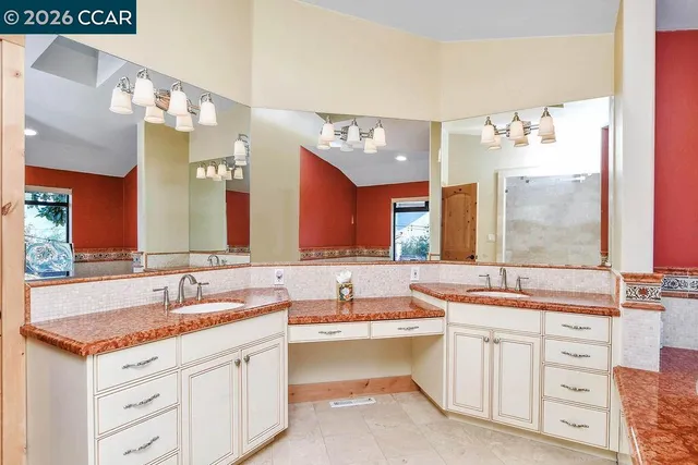 a bathroom with bathtub and window