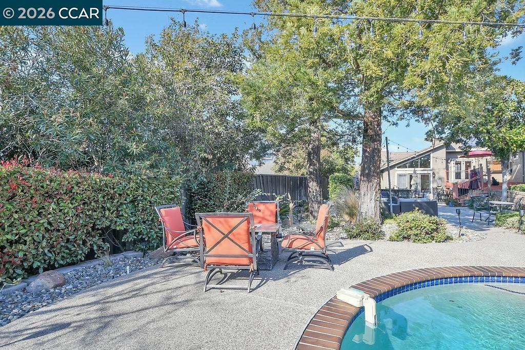 5308 Vista Point Court Concord, CA 94521 - Photo 51 of 56 an outdoor sitting area with brick walls and trees