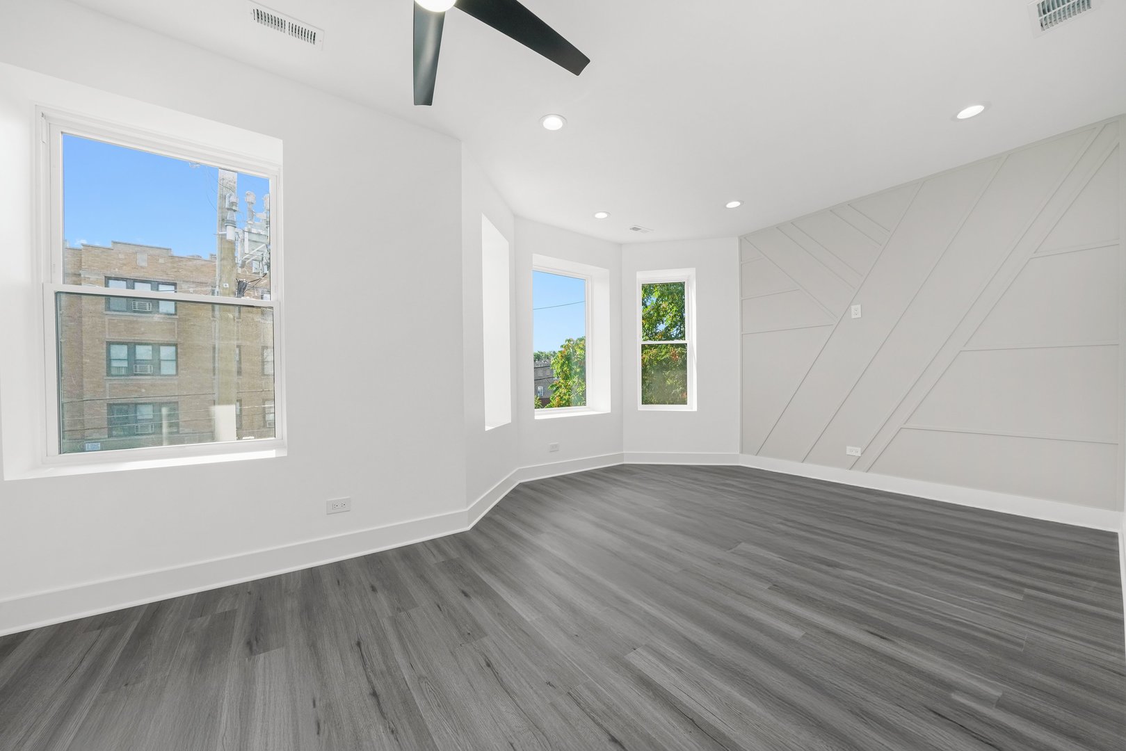 322 South Kostner Avenue Chicago, IL 60624 - Photo 16 of 35 an empty room with wooden floor and windows