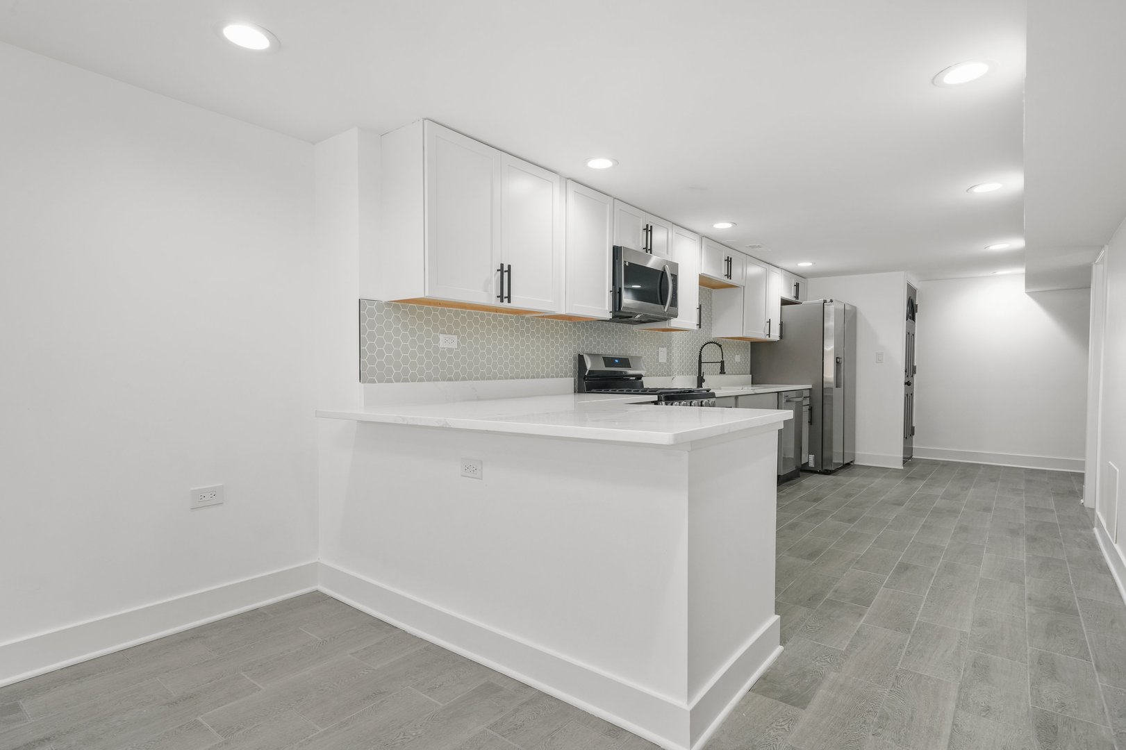 322 South Kostner Avenue Chicago, IL 60624 - Photo 23 of 35 a kitchen with kitchen island a sink appliances and cabinets
