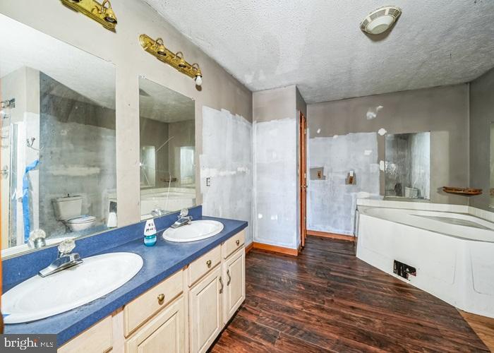 62 Hillview Lane Tioga, PA 16946 - Photo 13 of 13 a bathroom with a granite countertop sink mirror and a shower