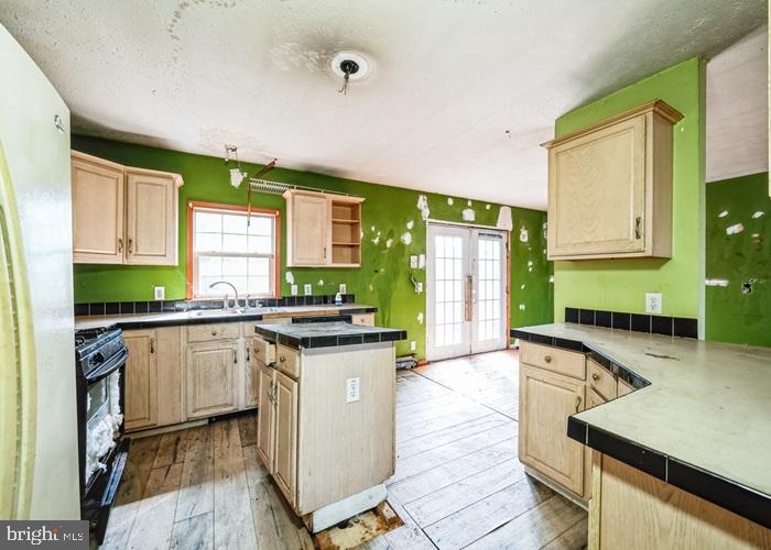 62 Hillview Lane Tioga, PA 16946 - Photo 8 of 13 a kitchen with granite countertop a sink stove and cabinets
