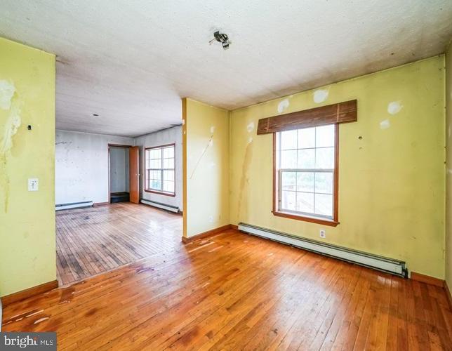 62 Hillview Lane Tioga, PA 16946 - Photo 10 of 13 a view of an empty room with wooden floor and a window