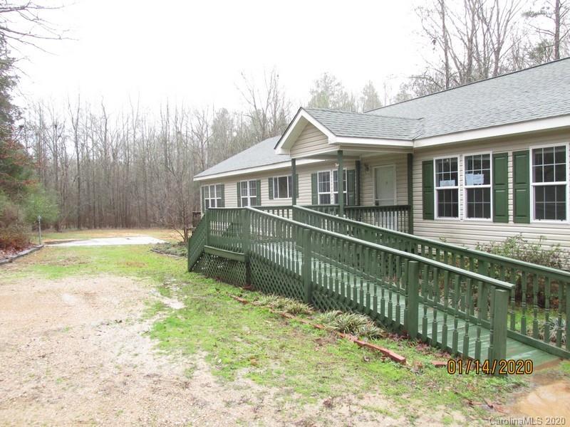 939 A Pinckney Road Chester, SC 29706 - Photo 2 of 14 a view of a house with a wooden deck and a yard