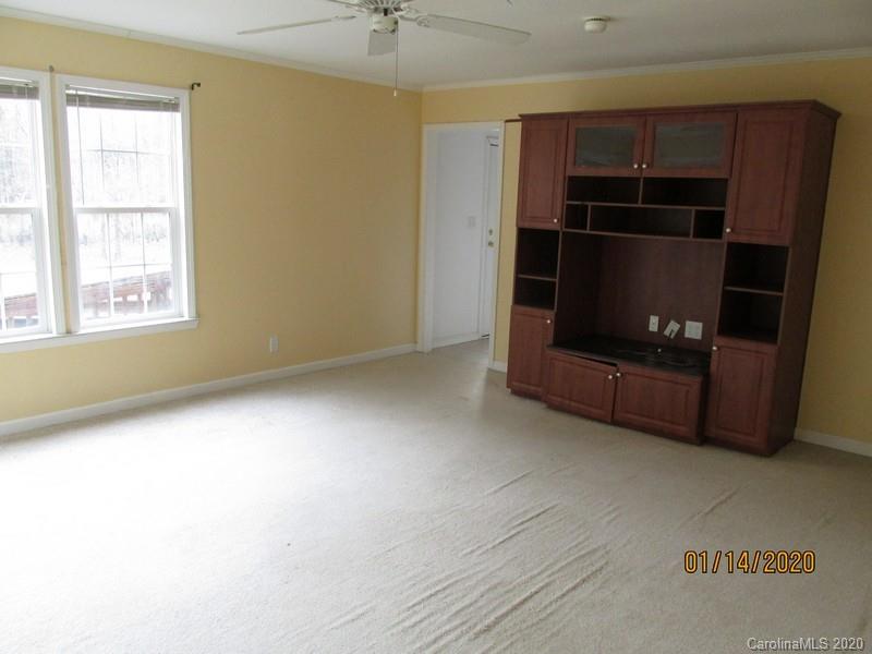 939 A Pinckney Road Chester, SC 29706 - Photo 11 of 14 a living room with closet and windows