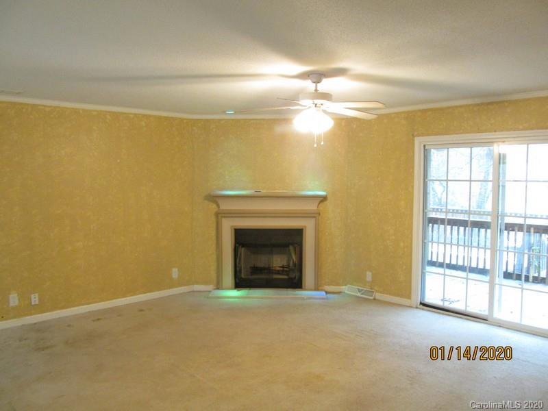 939 A Pinckney Road Chester, SC 29706 - Photo 5 of 14 a view of empty room with window and fireplace