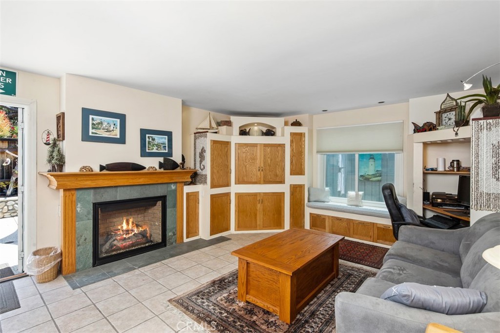 181 Sunset Terrace Laguna Beach, CA 92651 - Photo 14 of 54 Family Room with Tile Floors and Fireaplce. Open to Backyard