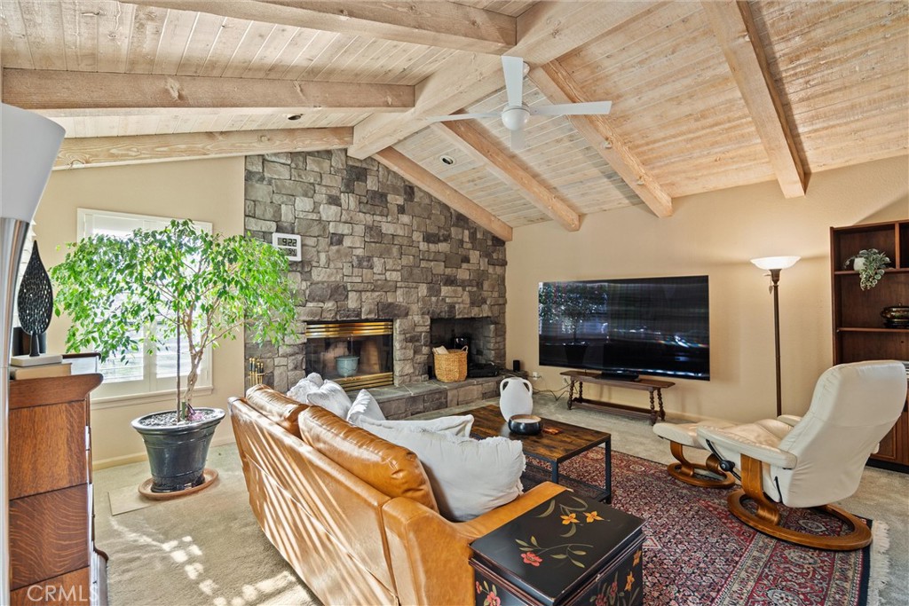 529 Countryside Lane Chico, CA 95973 - Photo 12 of 51 a living room with furniture a flat screen tv and a fireplace