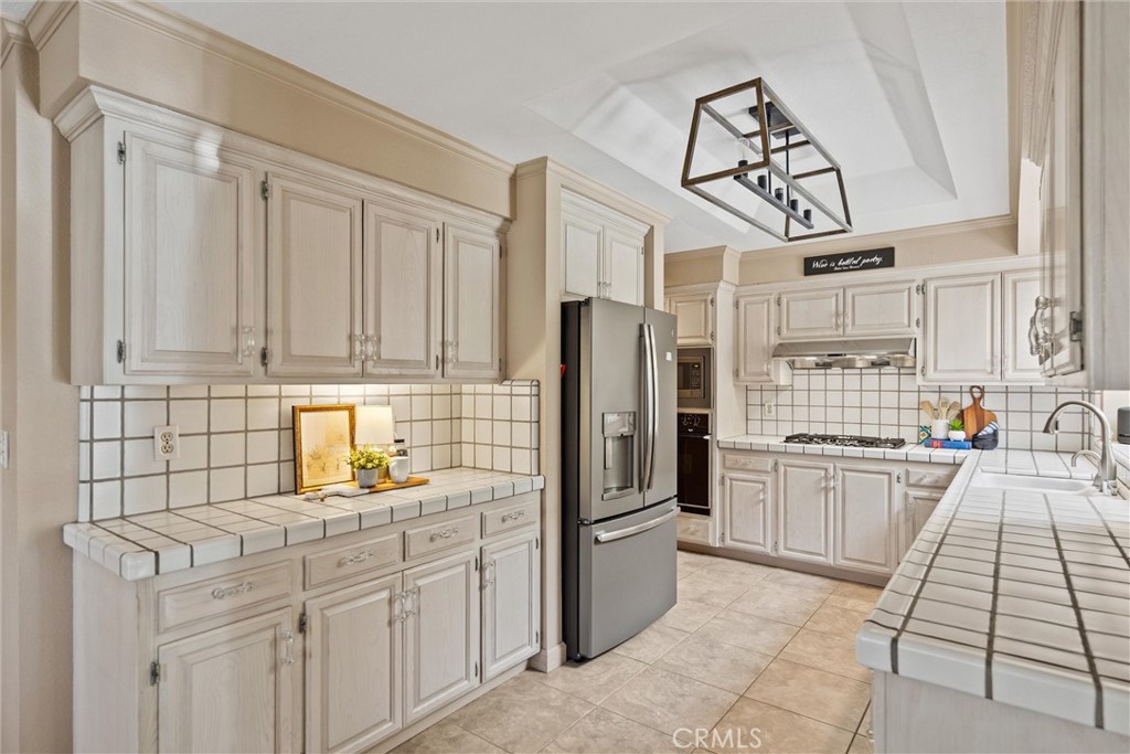 529 Countryside Lane Chico, CA 95973 - Photo 18 of 51 a kitchen with stainless steel appliances granite countertop a refrigerator and a stove top oven