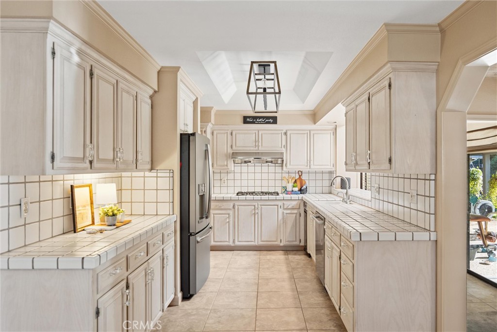 529 Countryside Lane Chico, CA 95973 - Photo 19 of 51 a kitchen with stainless steel appliances granite countertop a stove and a sink