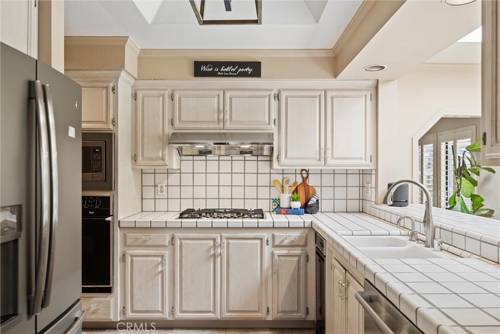 529 Countryside Lane Chico, CA 95973 - Photo 21 of 51 a kitchen with stainless steel appliances cabinets a sink and a refrigerator