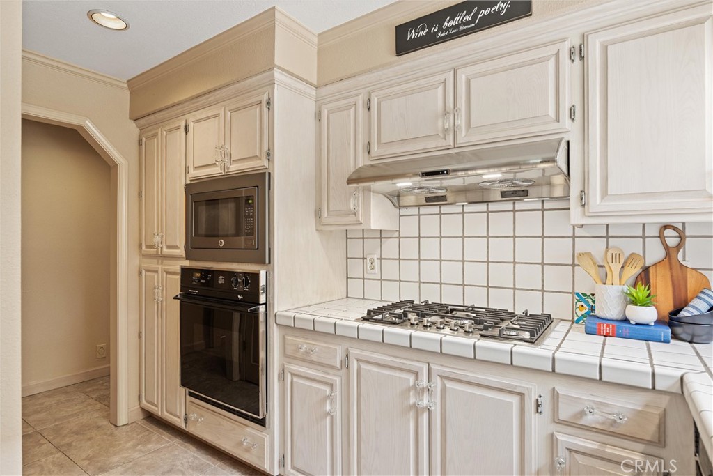 529 Countryside Lane Chico, CA 95973 - Photo 22 of 51 a kitchen with granite countertop a stove and a sink