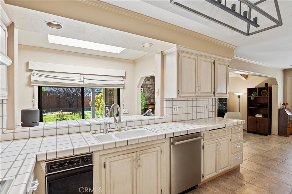 529 Countryside Lane Chico, CA 95973 - Photo 23 of 51 a kitchen with stainless steel appliances granite countertop a stove and a sink