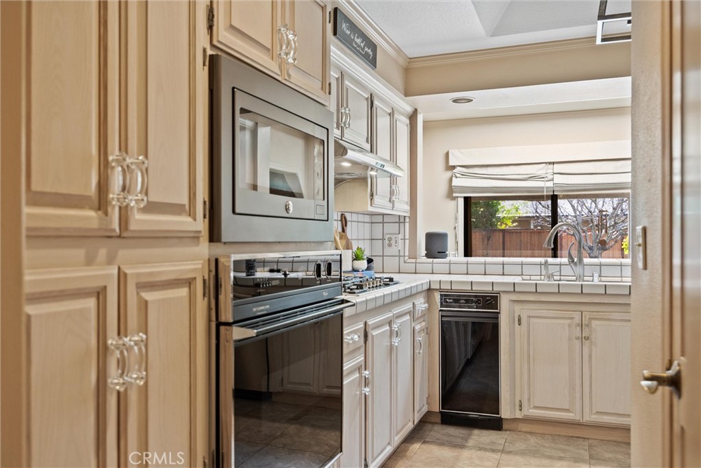 529 Countryside Lane Chico, CA 95973 - Photo 25 of 51 a kitchen with stainless steel appliances granite countertop a stove and a sink