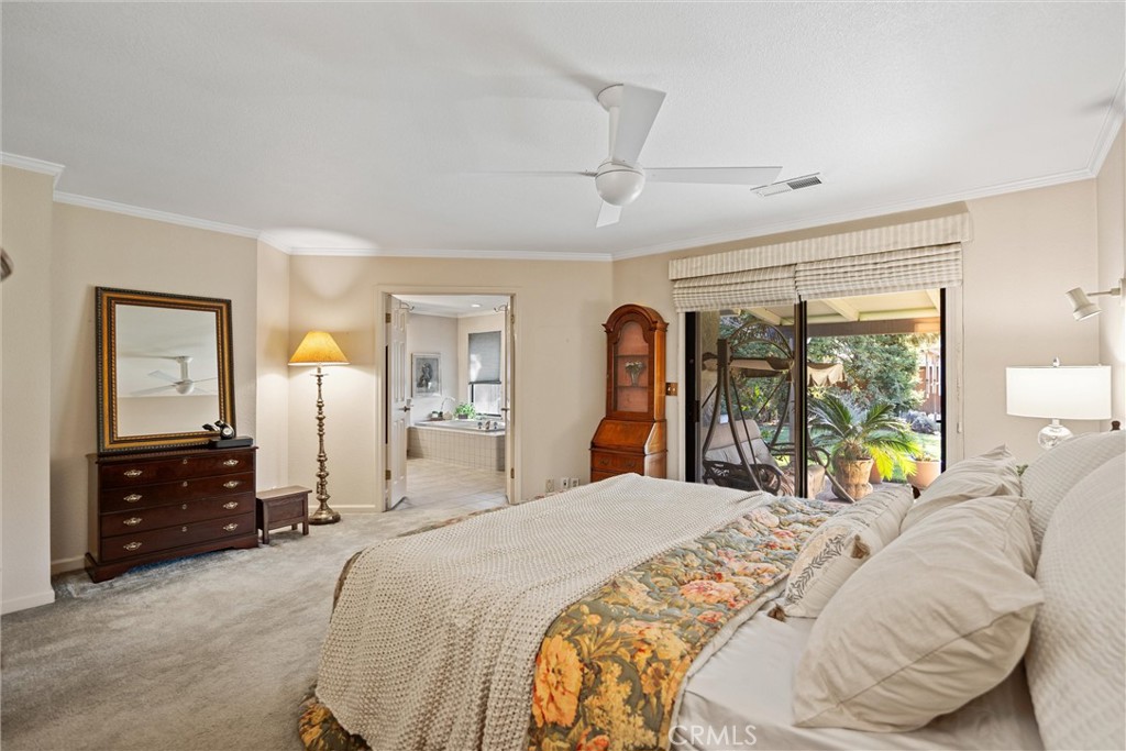 529 Countryside Lane Chico, CA 95973 - Photo 28 of 51 a bedroom with a bed and a large mirror on dresser