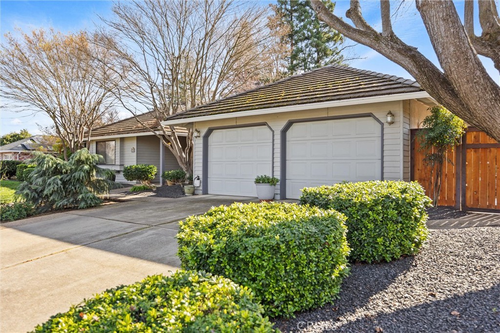 529 Countryside Lane Chico, CA 95973 - Photo 3 of 51 a front view of a house with garden