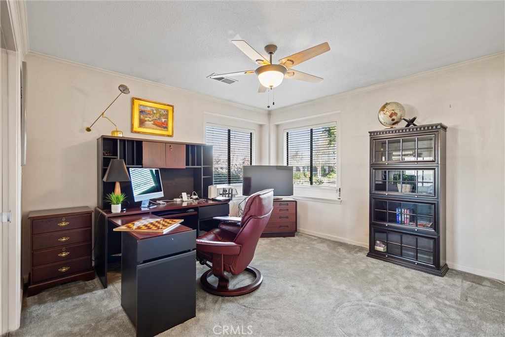 529 Countryside Lane Chico, CA 95973 - Photo 34 of 51 a living room with furniture a bookshelf and a window
