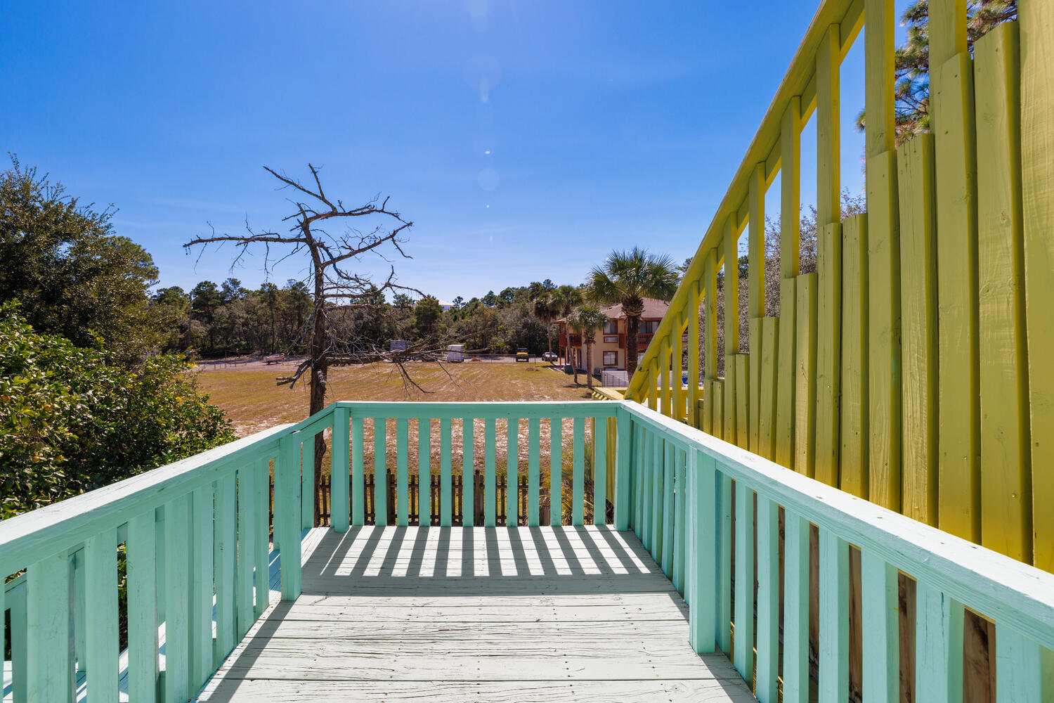 145 Cain Road Panama City Beach, FL 32413 - Photo 15 of 60 a view of balcony with wooden floor and fence