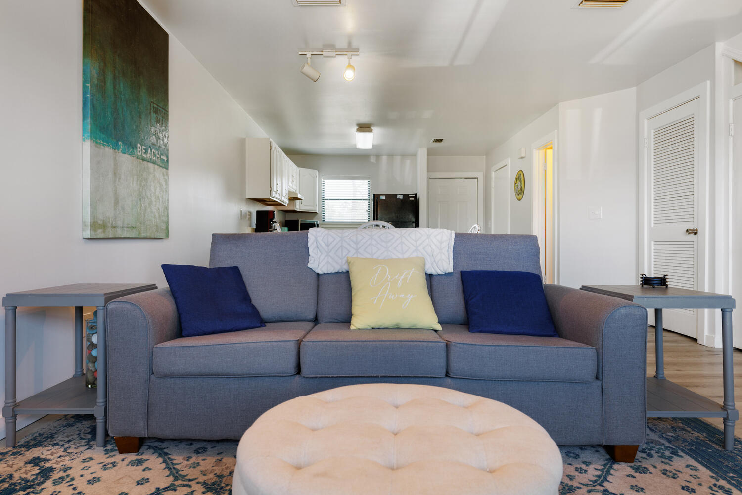 145 Cain Road Panama City Beach, FL 32413 - Photo 17 of 60 a living room with furniture and a chandelier