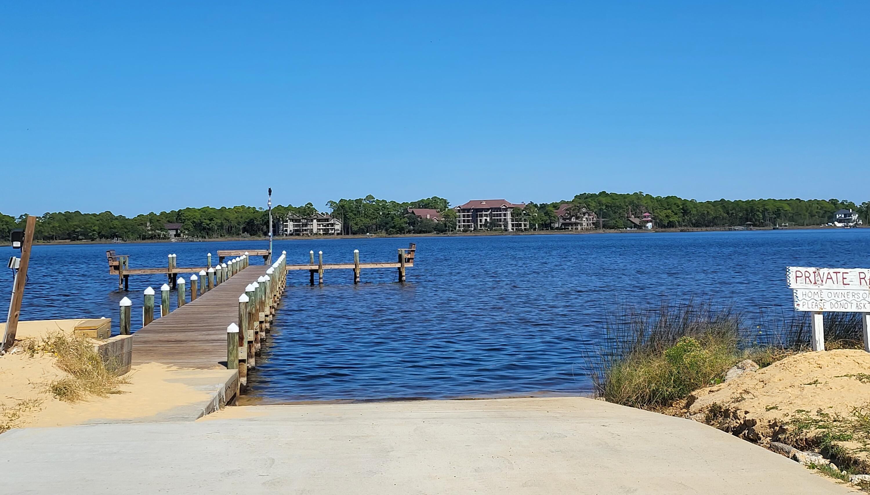 145 Cain Road Panama City Beach, FL 32413 - Photo 2 of 60 a view of a terrace with a lake view