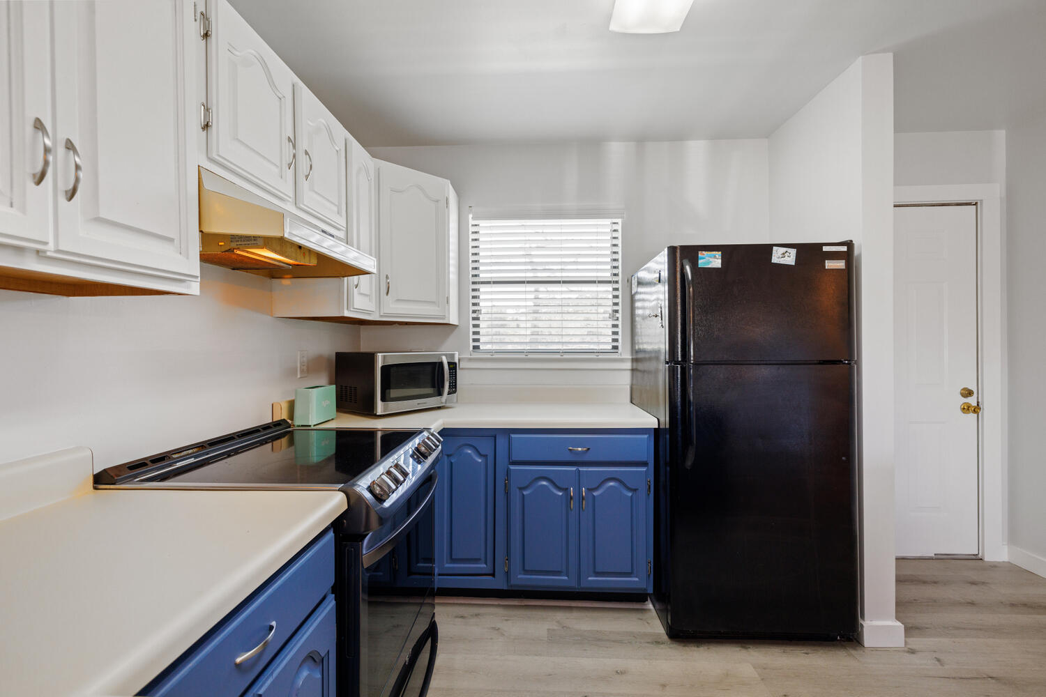 145 Cain Road Panama City Beach, FL 32413 - Photo 23 of 60 a kitchen with stainless steel appliances granite countertop a refrigerator a stove and a sink